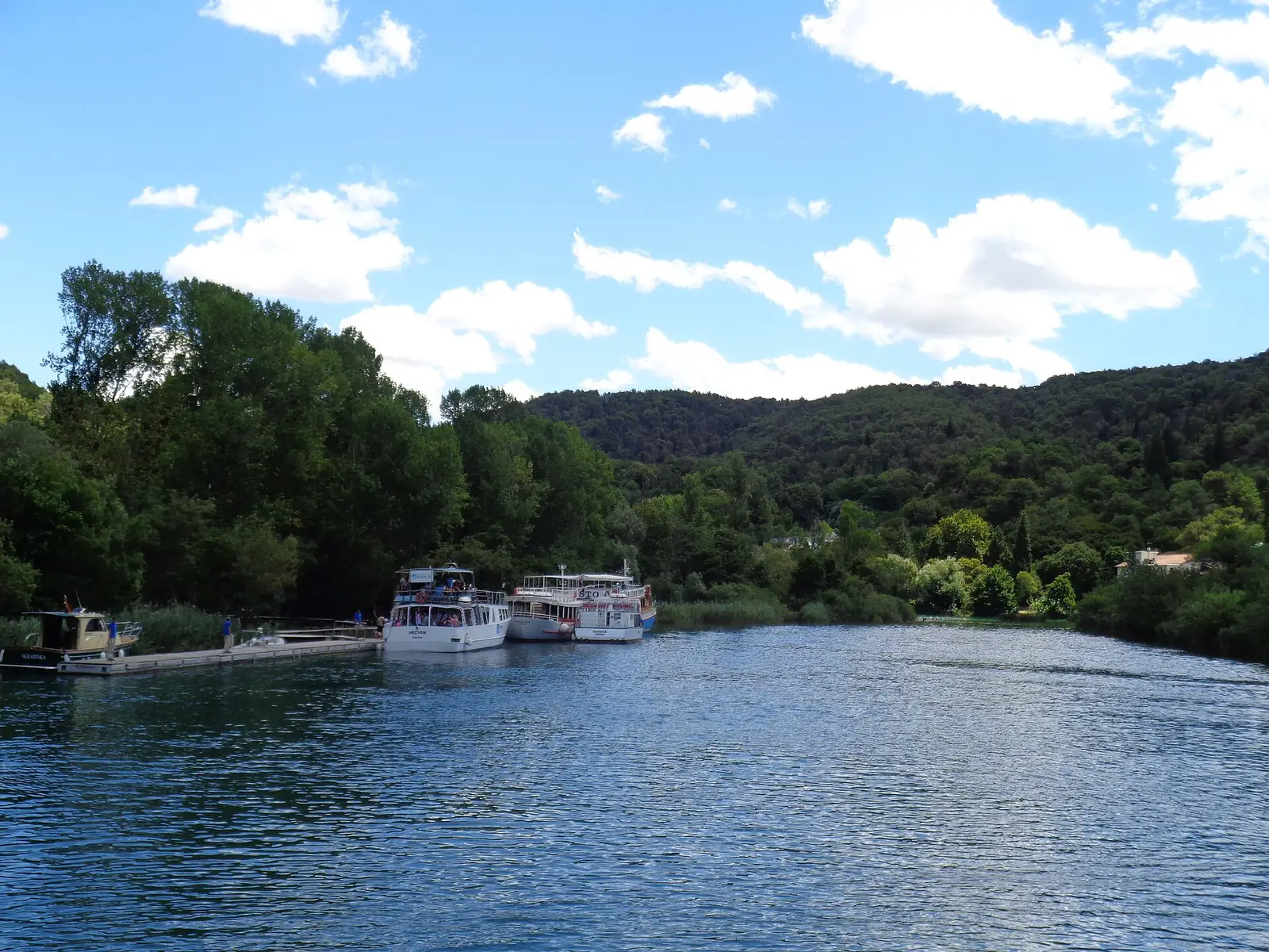The park boat crossing the ria — internal transport included in the entry ticket, not a separate fare